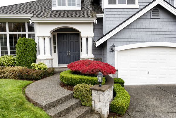 Exposed aggregate concrete was used for the driveway and stairs for this Coquitlam home.